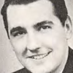 Dave Diles - WXYZ - WDEEBlack-and-white portrait of a smiling man in a suit.