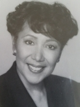 LaVere Burdette - Smiling woman with short dark curly hair in a blazer; black-and-white portrait.