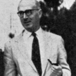 John Knight - Older man in a light suit and dark tie walking outdoors, wearing glasses.