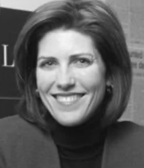 reedy2webp - BroadcastingVault.com Margie Reedy - Smiling woman with shoulder-length hair wearing a black turtleneck.